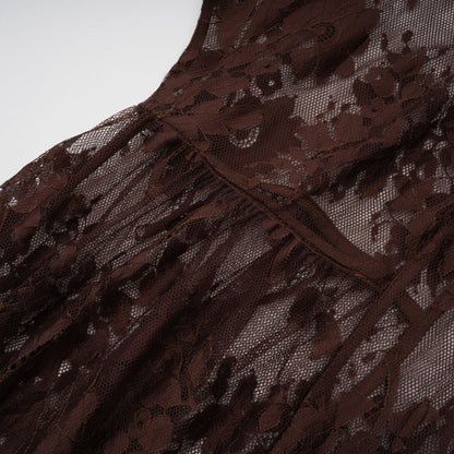 A brown flared midi dress made of chantilly lace named Sylvie on a plain background