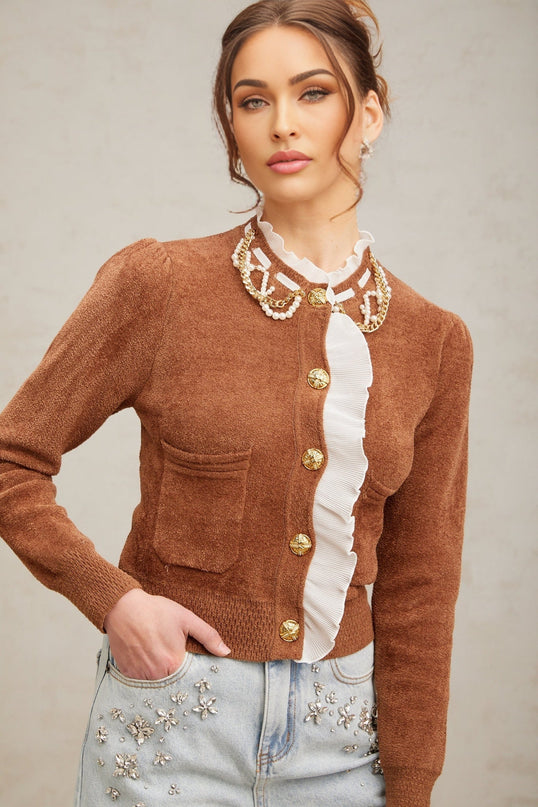 A brown knit cardigan with ruffled details and embellishments named Elisabetta