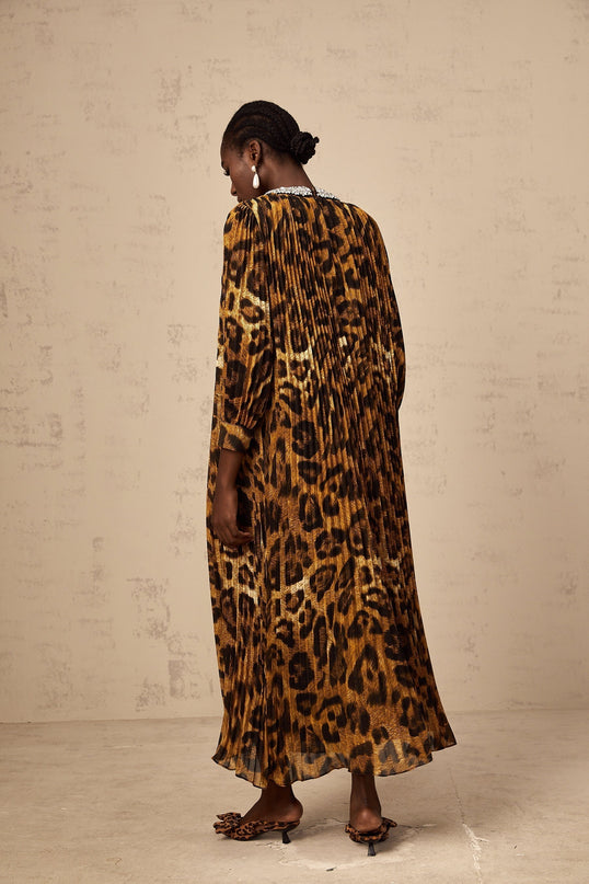 A brown leopard print midi dress with embellishments named Anais shown on a mannequin or model against a plain background