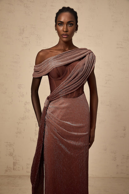 A brown maxi dress with a corsetstyle bodice featuring a ribbon design named Delphine The dress has a long flowing skirt and likely accentuates the waist