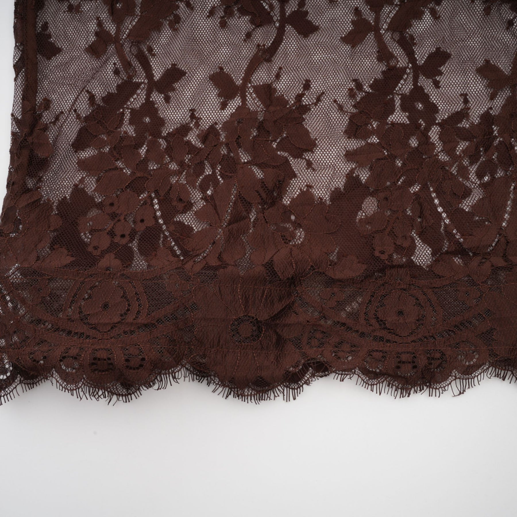 A brown midi dress with flared skirt made of chantilly lace named Sylvie
