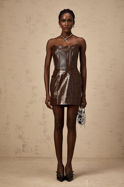 A brown textured leather mini dress with a short skirt and fitted silhouette