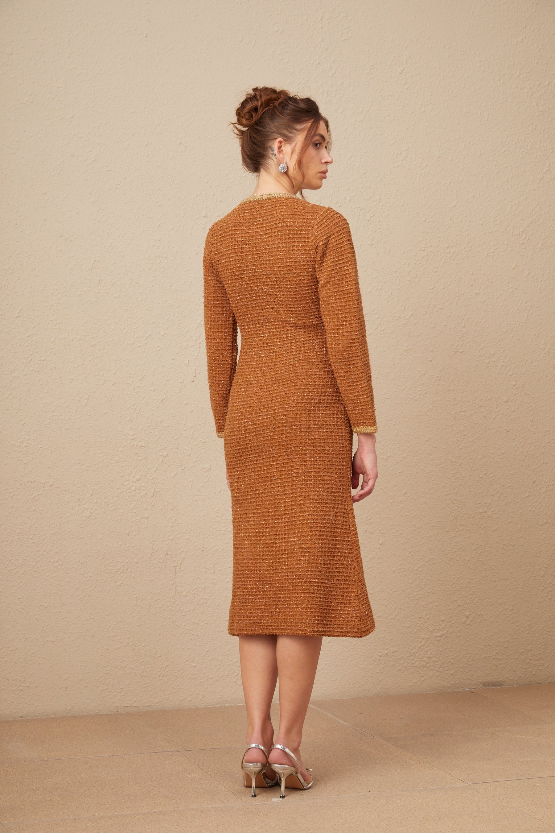 A brown tweed dress with braided edges and a fitted silhouette named Epona
