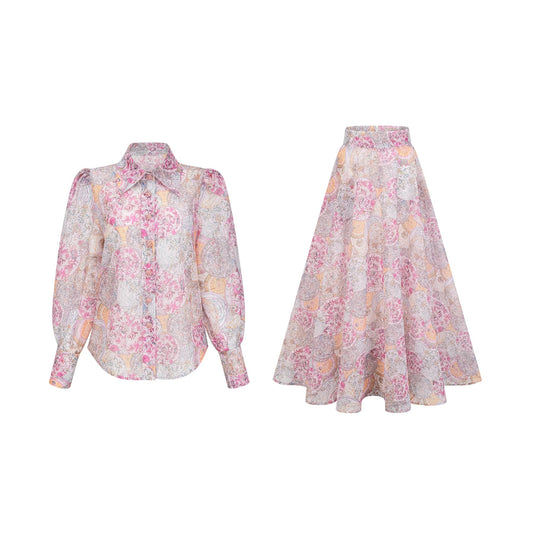 A cherry pink matching set featuring a patterned shirt and skirt with a coordinating print design