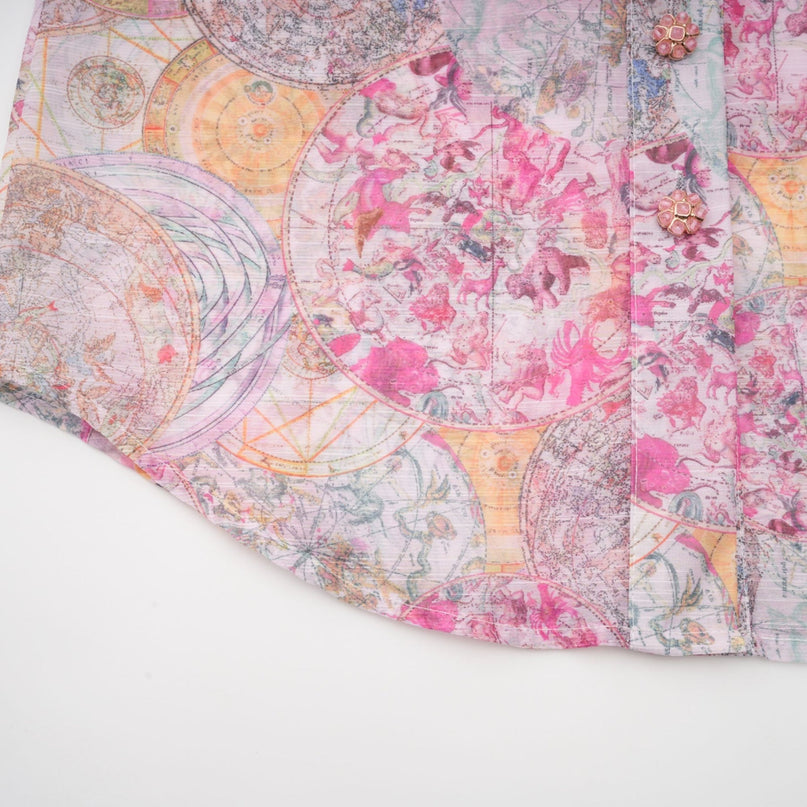 A cherry pink matching set featuring a patterned shirt and skirt with a floral or fruit print design