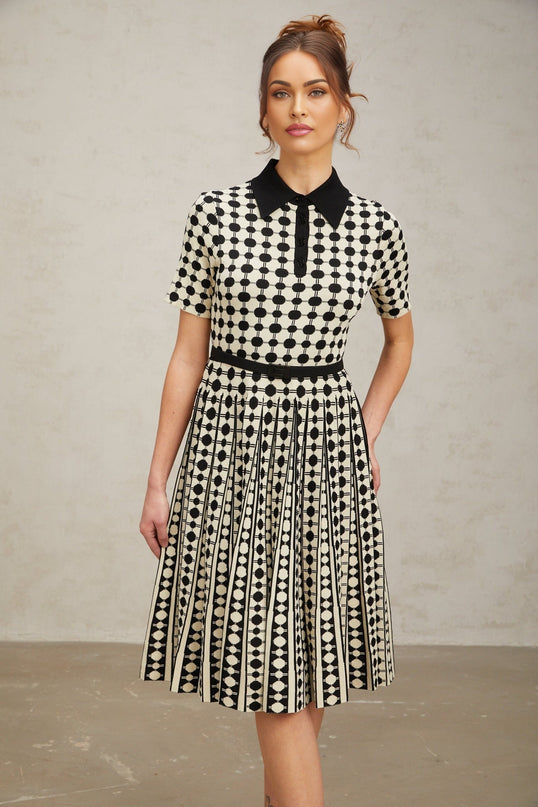 A colorful knit midi dress with polka dot pattern and color blocking design from Xaviere