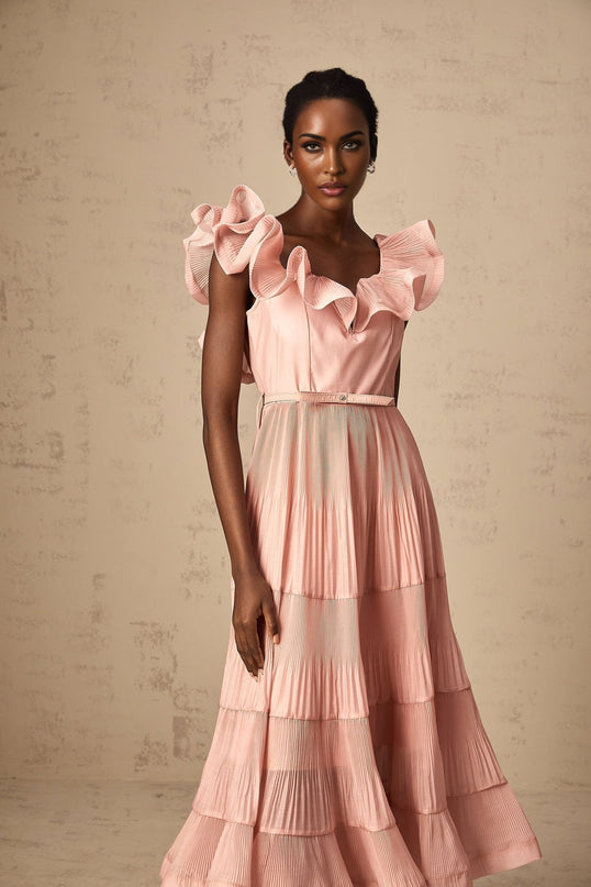 A coralpink midi dress with pleated details and frilly accents named Valentina