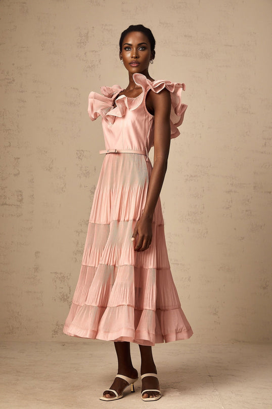 A coralpink midi dress with pleated fabric and frilly details named Valentina