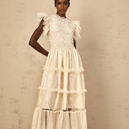 A cream white maxi dress for women with tiered tulle skirt and floral embroidery details