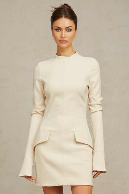 A creamwhite fitted mini dress by Chloé on a plain background