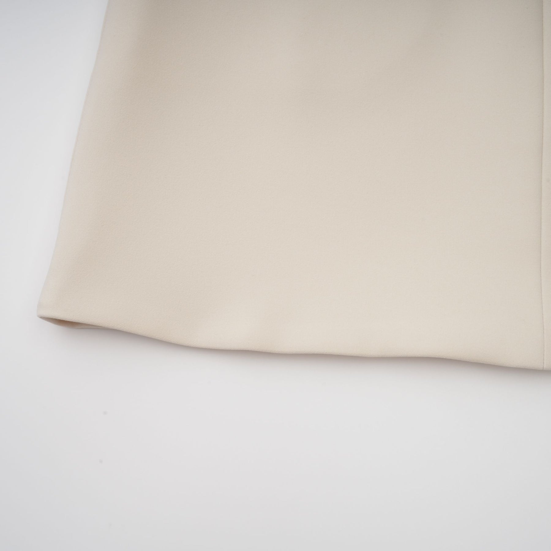 A creamwhite fitted mini dress by Chloé on a plain background