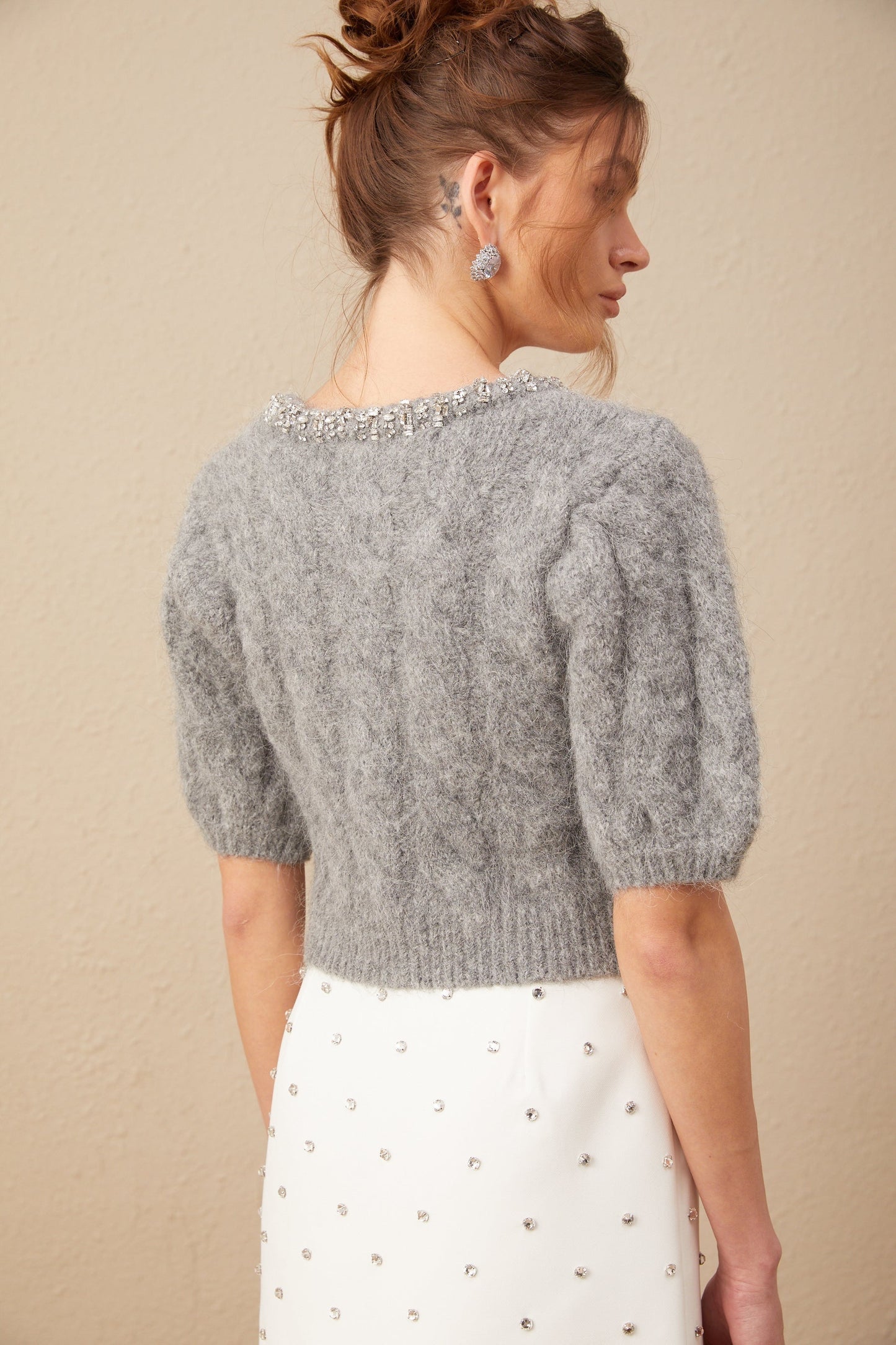 A cropped cableknit sweater in mohair fabric with embellishments named Ophélie featuring a short length and decorative knit patterns