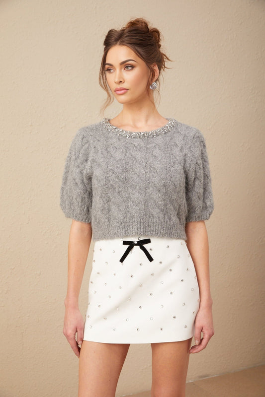 A cropped cableknit sweater in mohair with embellishments featuring a short length and textured design named Ophelie