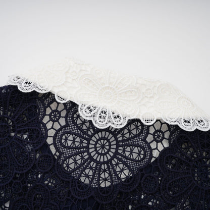 A dark blue midi dress with floral crochet lace pattern and delicate details