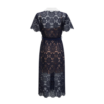 A dark blue midi dress with floral crochet lace pattern covering the bodice and skirt