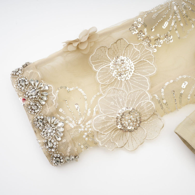 A delicate semi sheer jacket with floral beaded details on organza fabric featuring a light and luxurious design