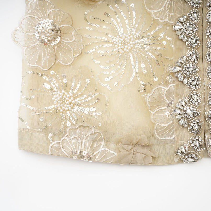 A delicate semi sheer organza jacket with floral beaded embellishments in a light luxury style