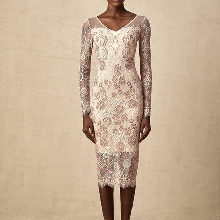 A fitted midi dress in white guipure lace with intricate floral patterns featuring short sleeves and a high neckline