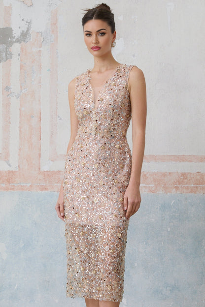 A fitted midi dress with a floral design featuring embellished Marguerite flowers adorning the fabric
