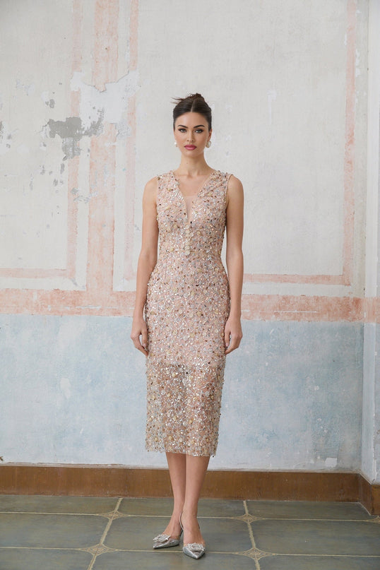 A fitted midi dress with a floral pattern featuring embellished marguerite flower motifs