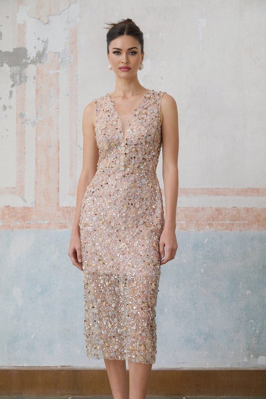A fitted midi dress with an embellished floral design featuring marguerite flower motifs