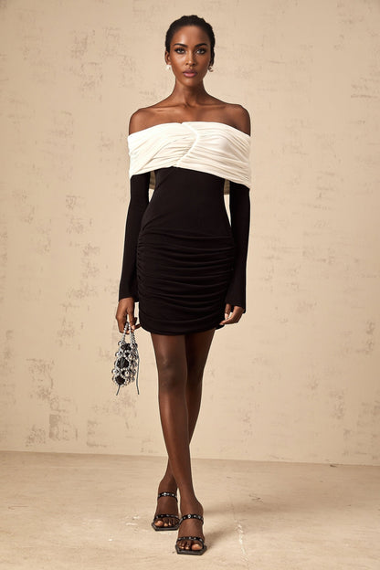 A fitted mini dress with colorblocking design featuring ruched details named Angelique