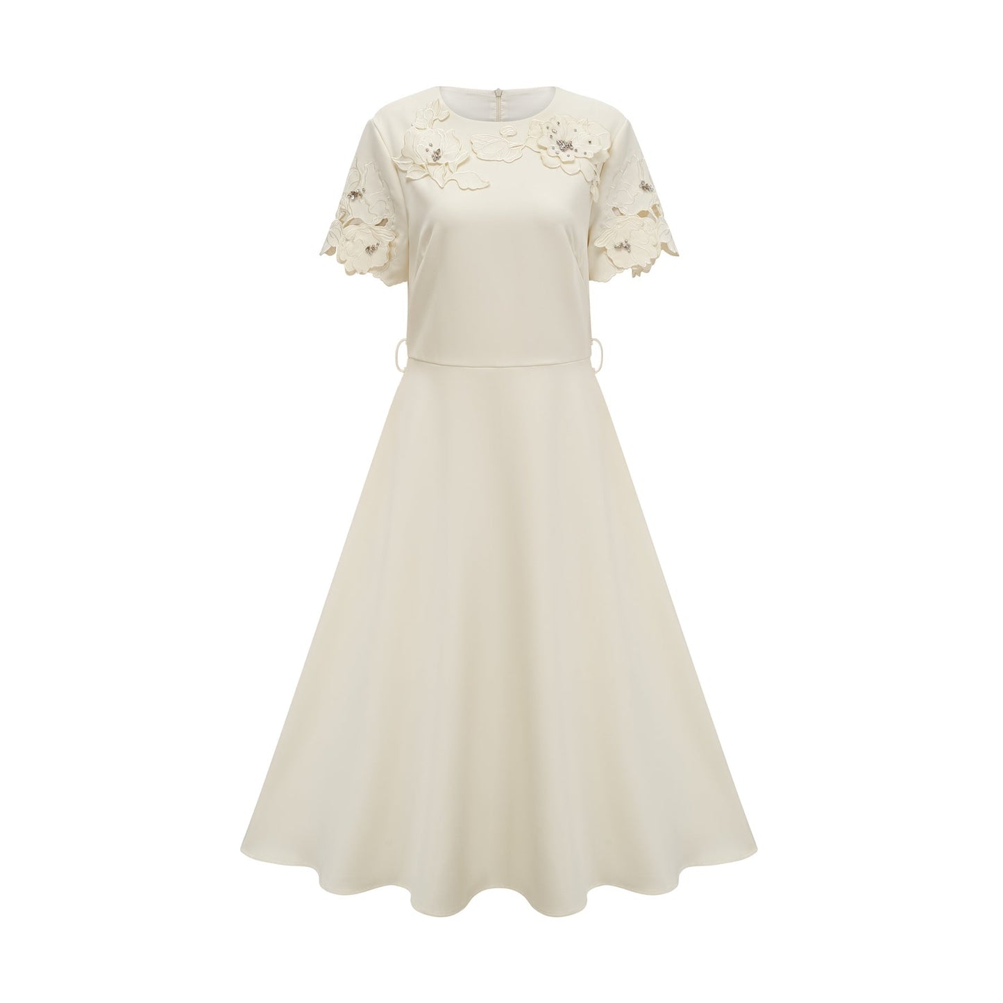 A flared midi dress in neutral tones featuring orange floral appliqués with a fitted bodice and flowing skirt