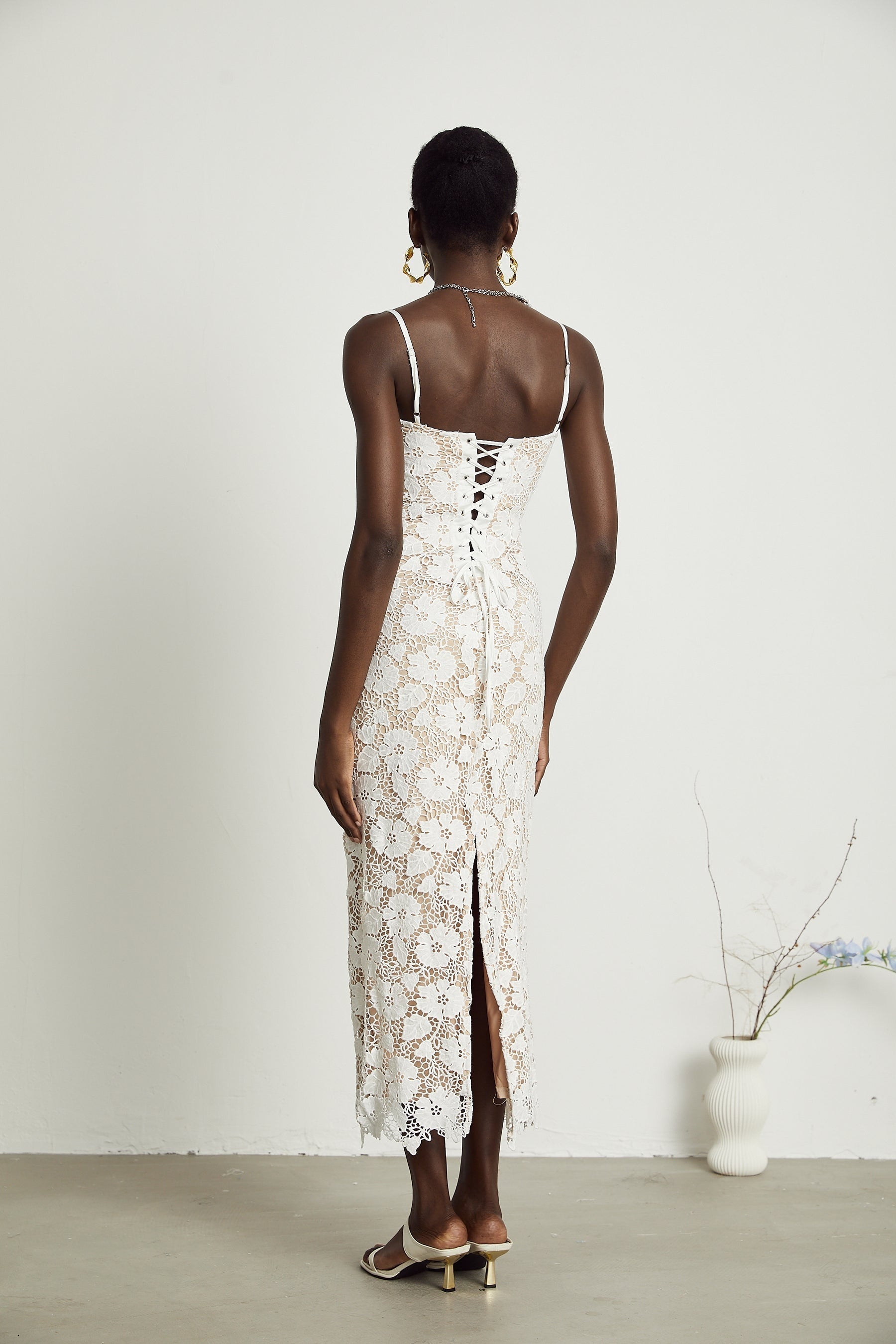 A floral embroidered midi dress in a Florence style featuring delicate stitched flower patterns on the fabric
