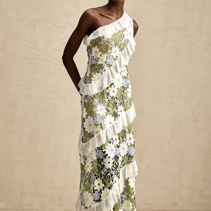 A floral embroidered midi dress named Clemence with a delicate pattern and feminine silhouette