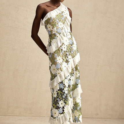 A floral embroidered midi dress named Clemence with a delicate pattern and feminine silhouette