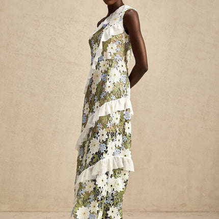 A floral embroidered midi dress with a Clémence design featuring delicate flower patterns on a light fabric