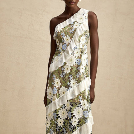 A floral embroidered midi dress with a feminine silhouette named Clemence featuring delicate floral patterns on a light colored fabric