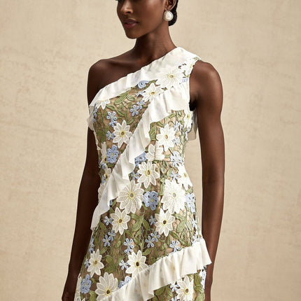 A floral embroidered midi dress with the name Clemence featuring delicate floral patterns on a light fabric background