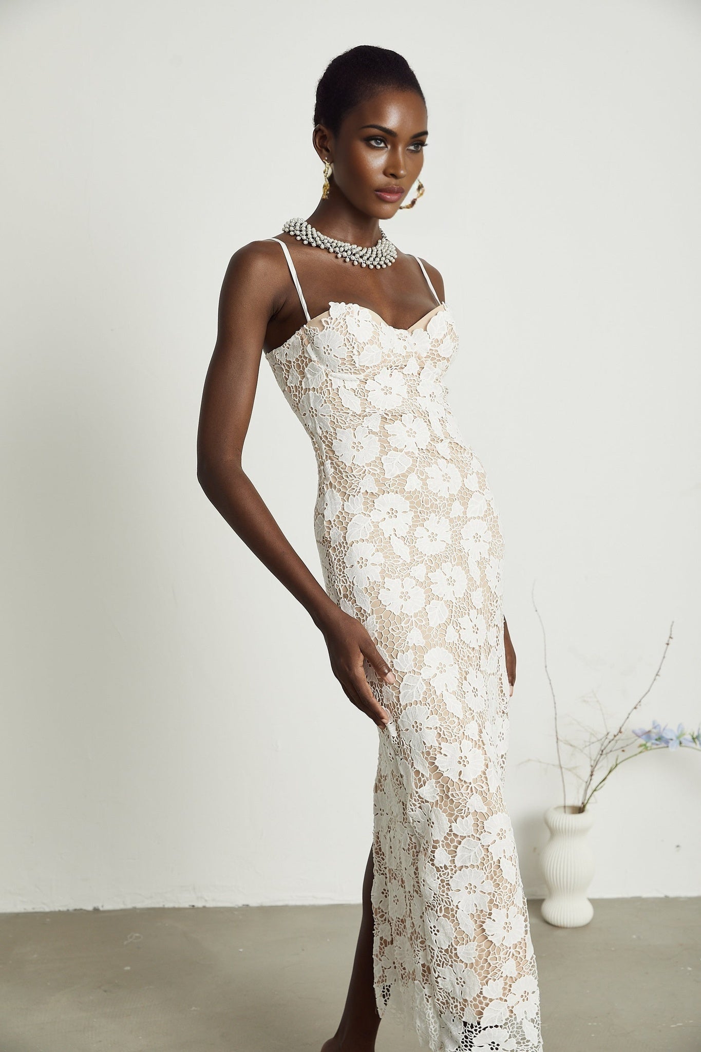 A floral embroidered midi dress with the name Florence featuring delicate stitched flower patterns on a flowing mid length silhouette