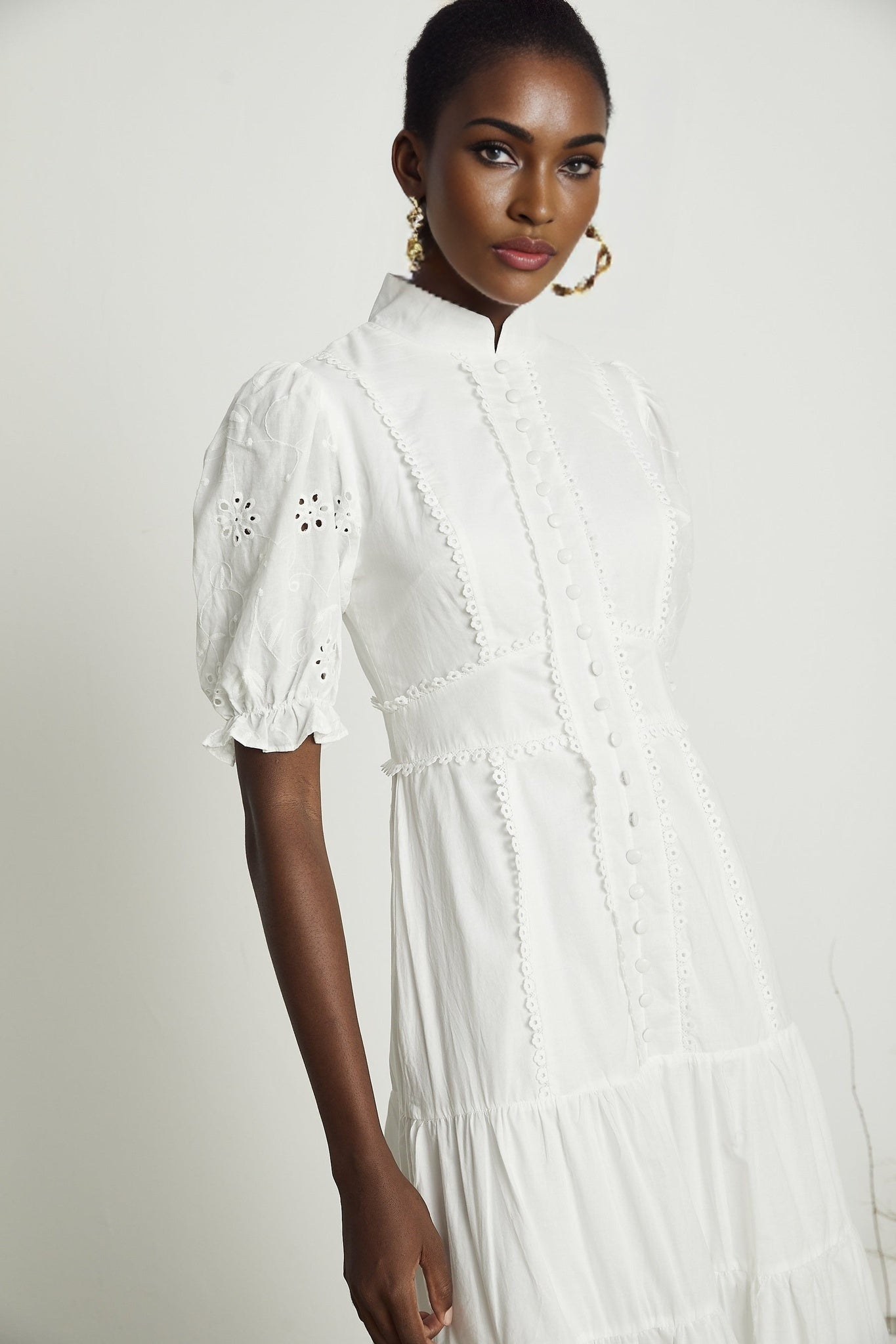 A floral lace midi dress with embroidered flowers and delicate details