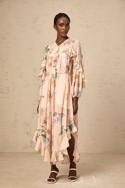 A floral patterned midi dress with ruffled trim named Patricia featuring a feminine silhouette and colorful print design