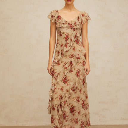 A floral print maxi dress with ruffled details and a flared silhouette in a long flowing style