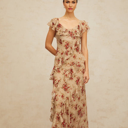 A floral print maxi dress with ruffles and a flared silhouette featuring a long flowing skirt and vibrant floral pattern