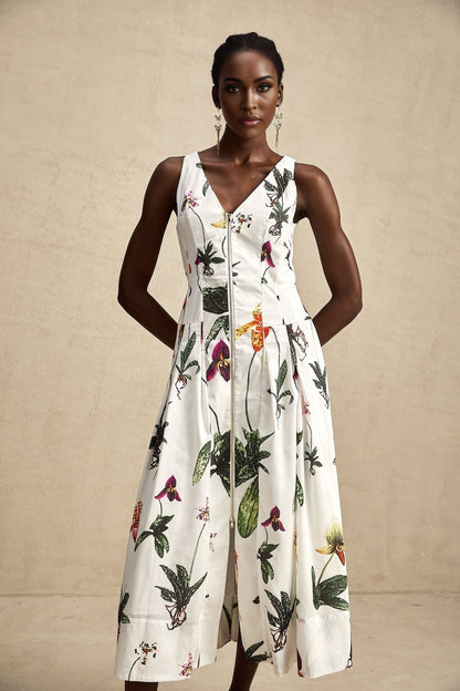 A floral print midi dress with a vneck made from poplin fabric featuring the Magali design