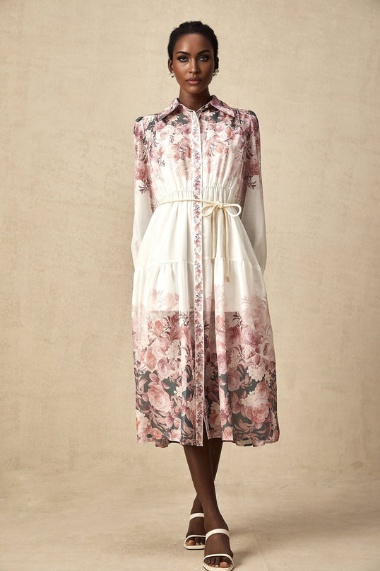 A floral print midi dress with lantern sleeves named Carina featuring a colorful pattern on a light background