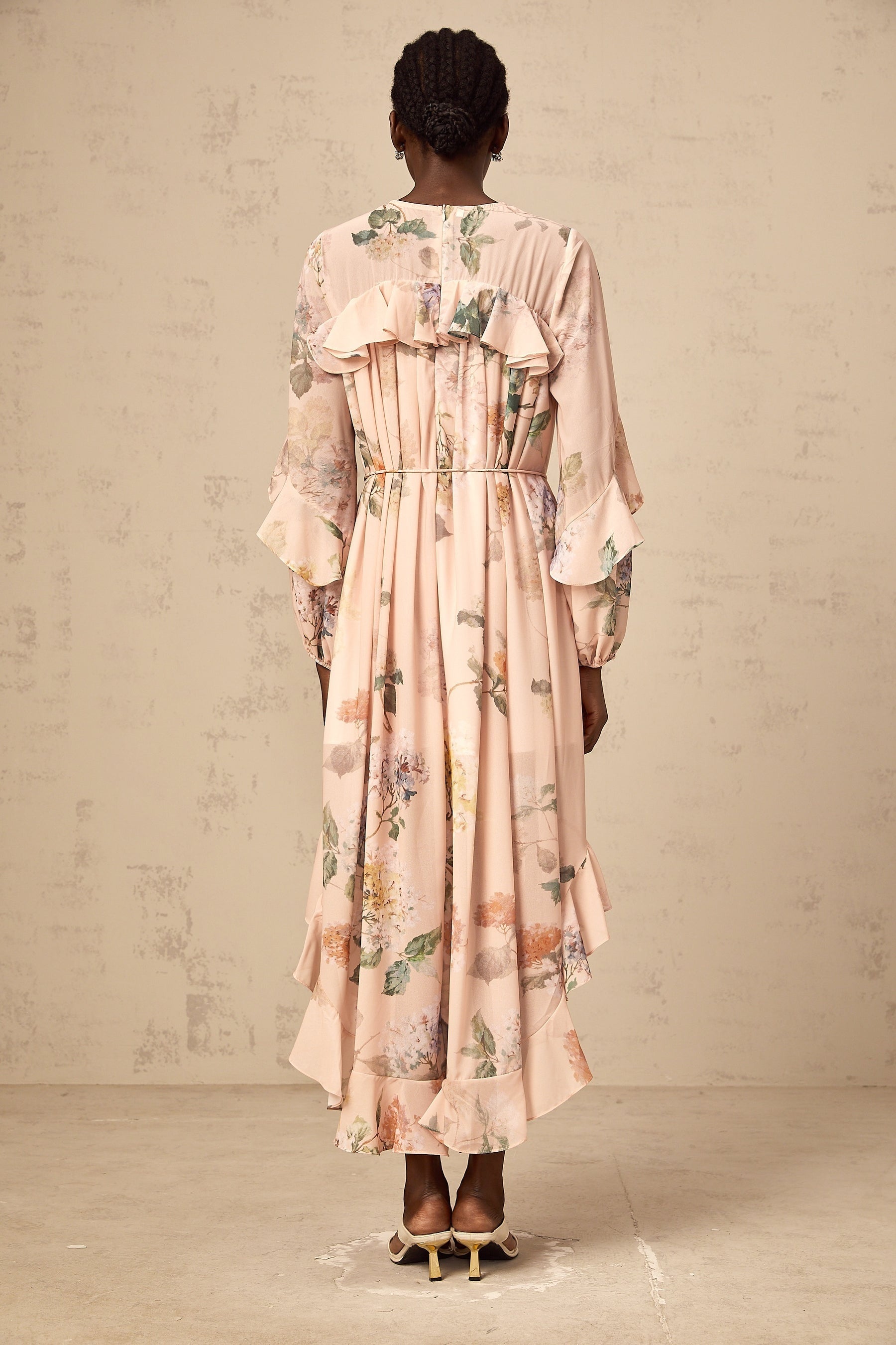 A floral print midi dress with ruffled trim named Patricia featuring a feminine silhouette and delicate pattern