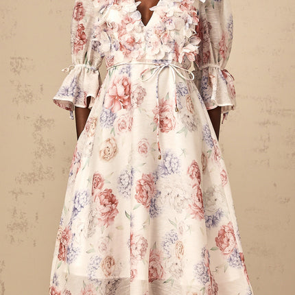 A floral print midi dress with three dimensional petal details featuring a Téa design