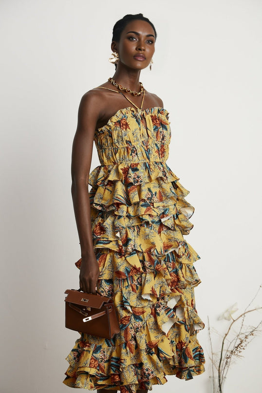 A floral print midi dress with tiered ruffles and a feminine silhouette named Apolline