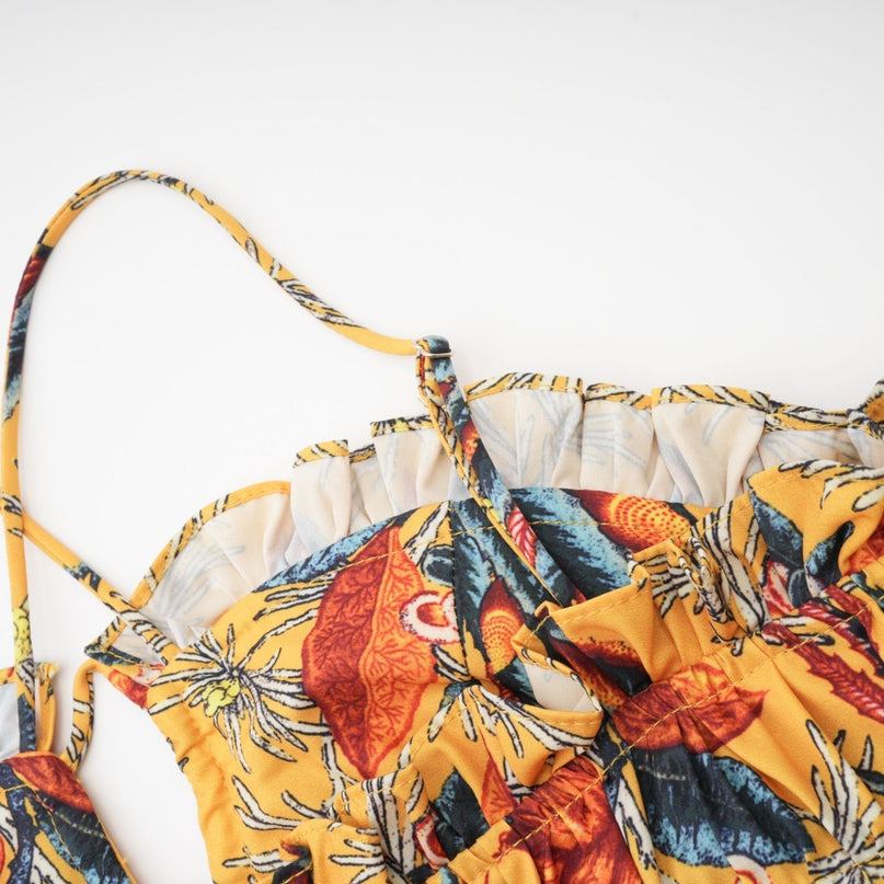 A floral print midi dress with tiered ruffles named Apolline