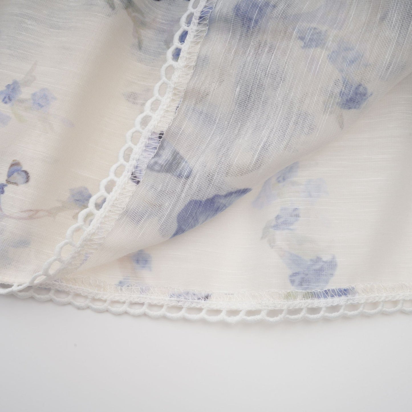 A floral print mini dress with a flared skirt made of chiffon fabric featuring a vibrant pattern and short length