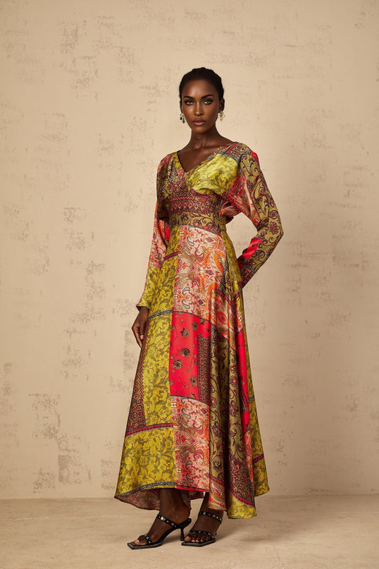 A green floral print midi dress with a flared skirt and fitted bodice worn by a female model