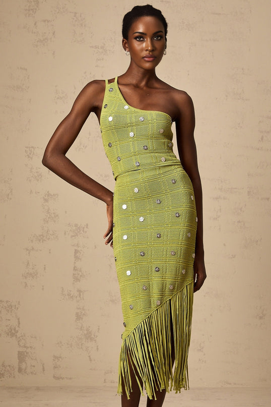 A green knitted two piece outfit consisting of a top and skirt The top features embellishments and the set is named Annette Both pieces match in color and style