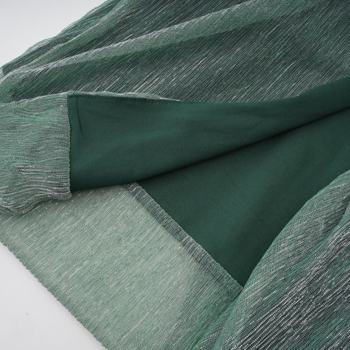 A green maxi dress with a corset bodice featuring a ribbon design and a long flowing skirt