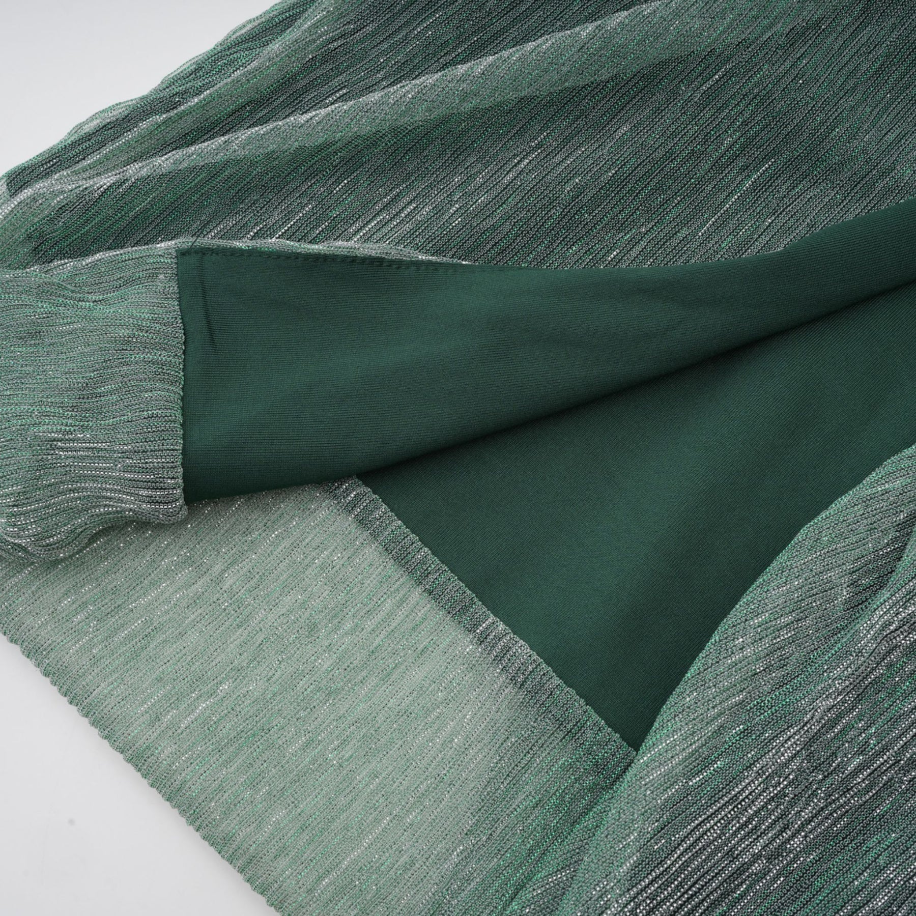 A green maxi dress with a corset bodice featuring a ribbon design and a long flowing skirt
