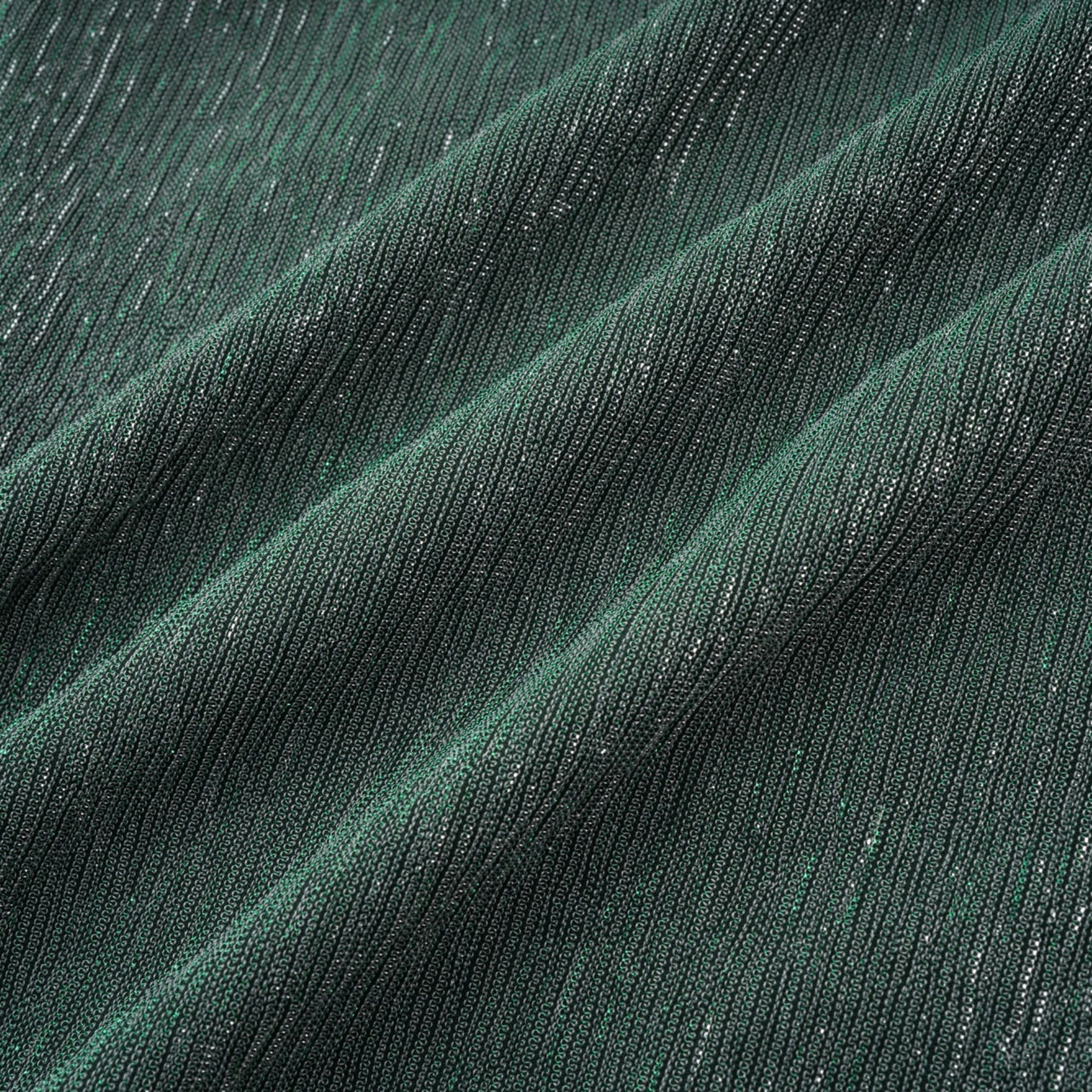 A green maxi dress with a corsetstyle bodice featuring ribbon detailing and a flowing long skirt